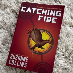 Red Catching Fire by Suzanne Collins